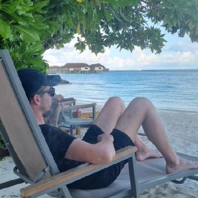 Eugenijus sitting by the beach